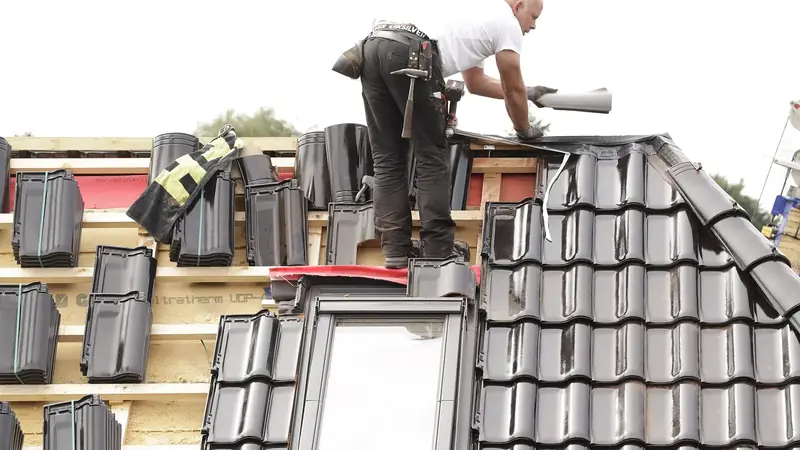 Roofer working on a tiled roof